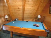 Pigeon Forge log cabin with pool table.